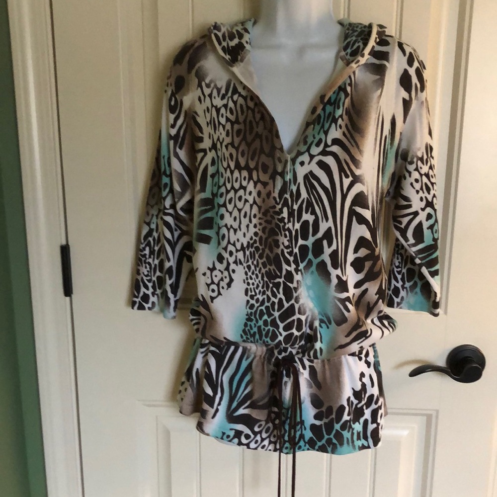 Cute brown and turquoise animal print pullover knit top with 3/4 sleeves.